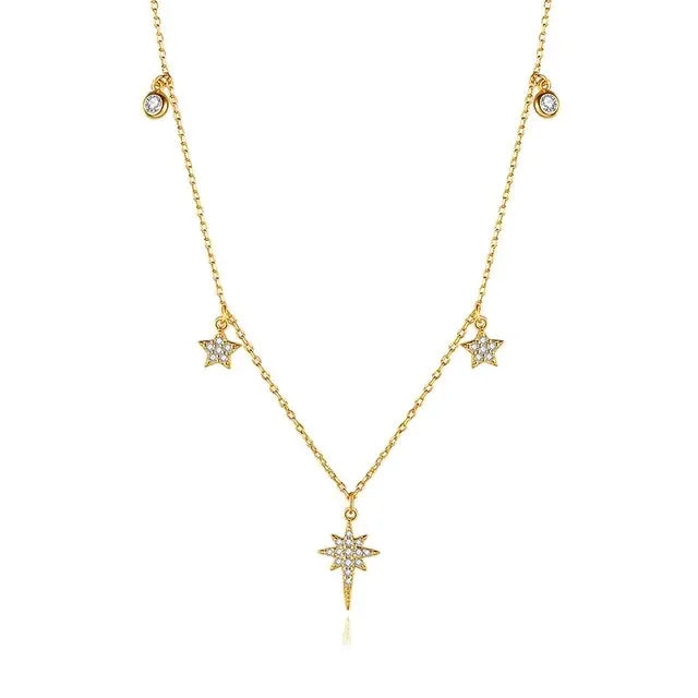 Dazzling gold star charm necklace with shimmering crystals, perfect for a unique statement look.