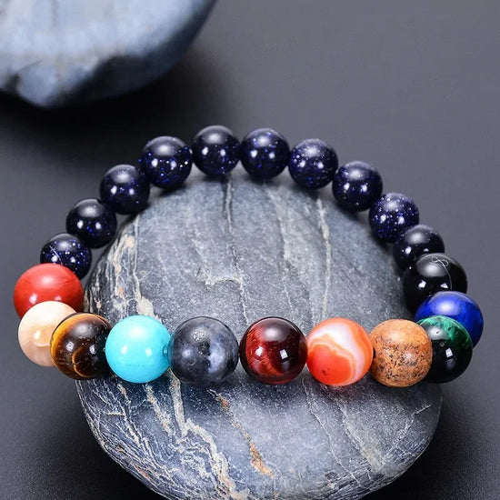 Vibrant multicolor gemstone beaded bracelet on smooth stone, unique jewelry for bold style
