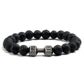 Unique black lava stone bracelet with silver dumbbell charm, perfect for bold personal style