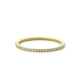 Elegant gold eternity band with sparkling pavé diamonds, perfect for a unique jewelry statement.