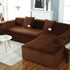 Luxurious brown sectional sofa with plush cushions in a stylish modern living room