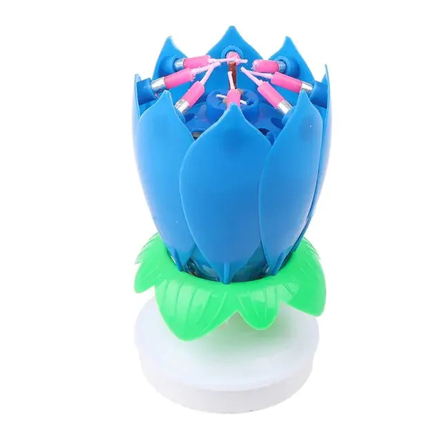 Vibrant blue lotus flower candle with pink accents and green leaves, unique home décor