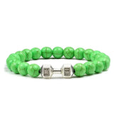 Vivid green beaded bracelet with unique silver dumbbell charm, a striking jewelry accent