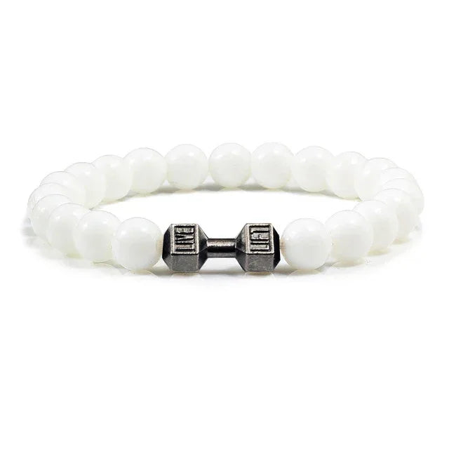 Striking white beaded bracelet with antique silver dumbbell charm, perfect for unique style lovers