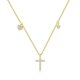 Sparkling gold necklace with cross, heart, and star charms, expressing unique elegance.