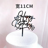 Chic black acrylic Happy Birthday cake topper with heart accents, perfect for unique birthday décor