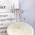 Shimmering silver happy birthday cake topper adds a unique, elegant touch to celebration cakes.