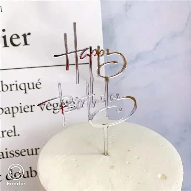 Shimmering silver happy birthday cake topper adds a unique, elegant touch to celebration cakes.