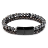 Curiously stylish bracelet with marbled beads and braided leather, featuring a sleek black clasp