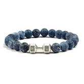 Blue stone beaded bracelet with unique silver dumbbell charm, perfect for stylish individuality.