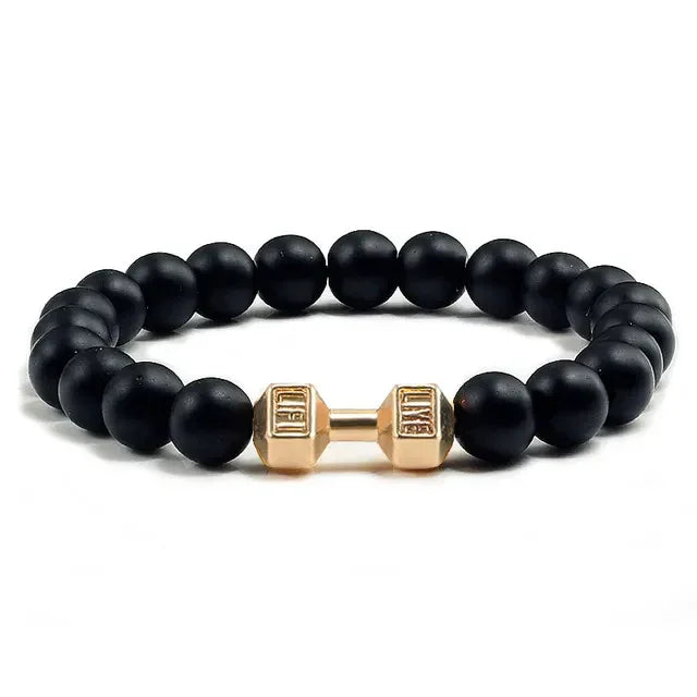 Matte black beaded bracelet with unique gold dumbbell accent, bold and stylish look