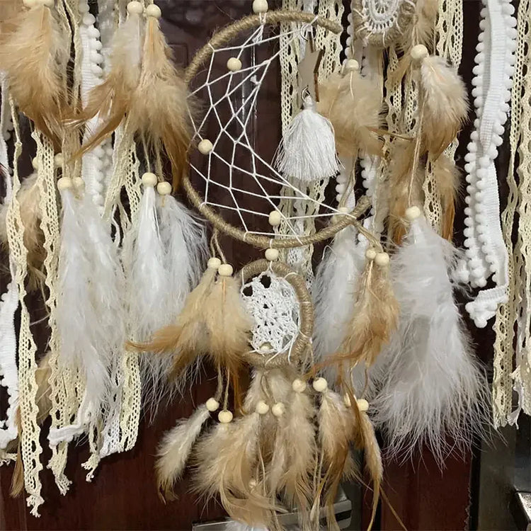 Boho dreamcatcher wall décor with lace, soft feathers, and wooden beads for unique home style