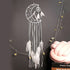 Unique crescent moon dreamcatcher with white feathers and beads, perfect for stylish wall decor.