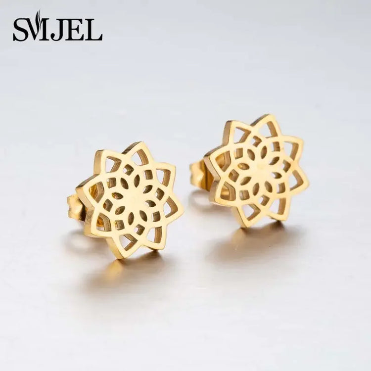 Intricately cut gold flower stud earrings, perfect for expressing unique jewelry style.