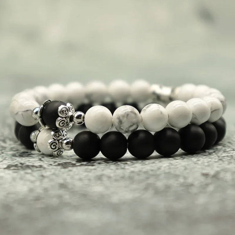 Elegant black and white stone bead bracelets with intricate silver accents, unique jewelry style