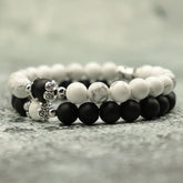 Elegant black and white stone bead bracelets with intricate silver accents, unique jewelry style