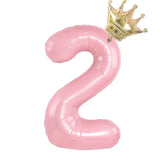 Shiny pink number 2 balloon with a gold crown, perfect for unique birthday party décor