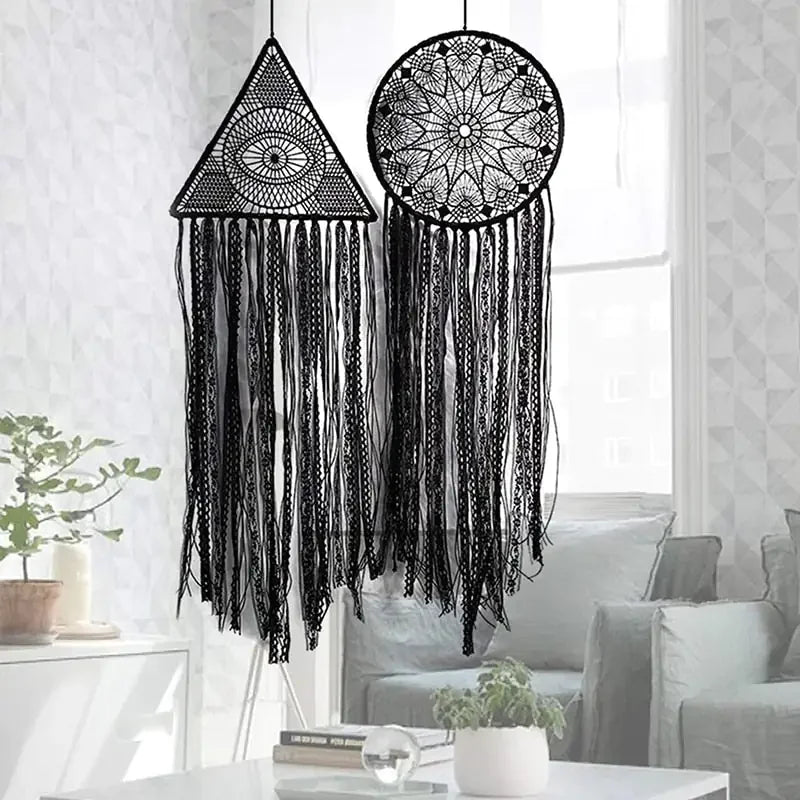 Unique black lace dreamcatchers with geometric patterns add intrigue to a modern living room.