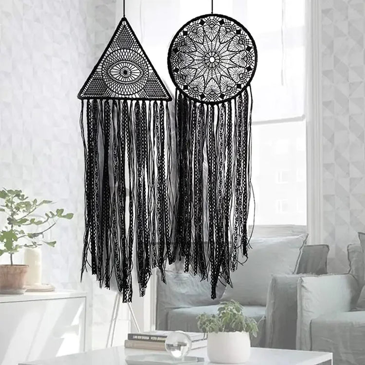 Unique black lace dreamcatchers with geometric patterns add intrigue to a modern living room.
