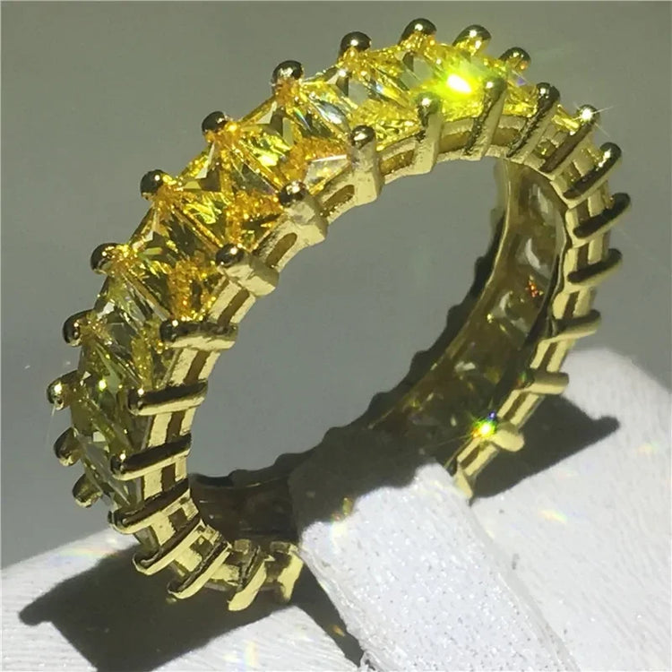 Dazzling yellow gemstone eternity band ring, gold setting, radiant and unique statement piece