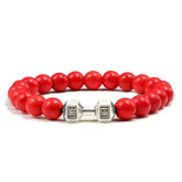 Bold red beaded bracelet with unique silver dumbbell charm, perfect for standout style
