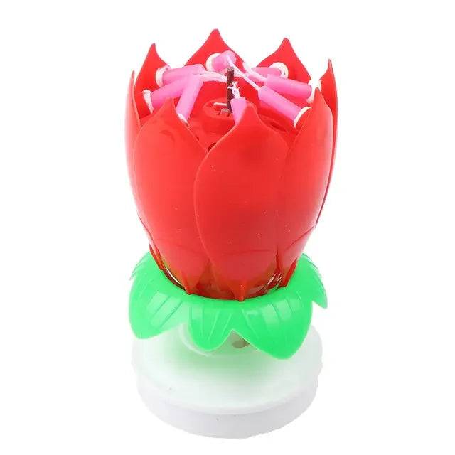 Intriguing red lotus flower candle with pink wicks and green leaves, perfect for unique décor