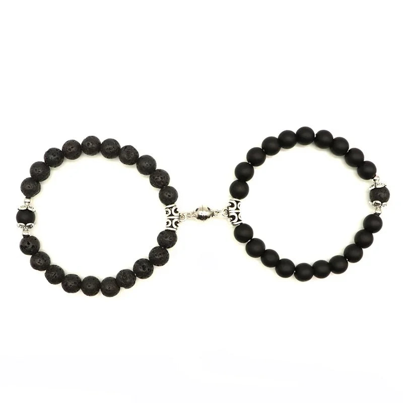 Unique black beaded bracelets with intricate silver accents, captivating modern jewelry design
