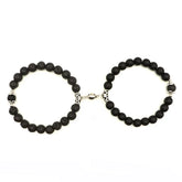Unique black beaded bracelets with intricate silver accents, captivating modern jewelry design