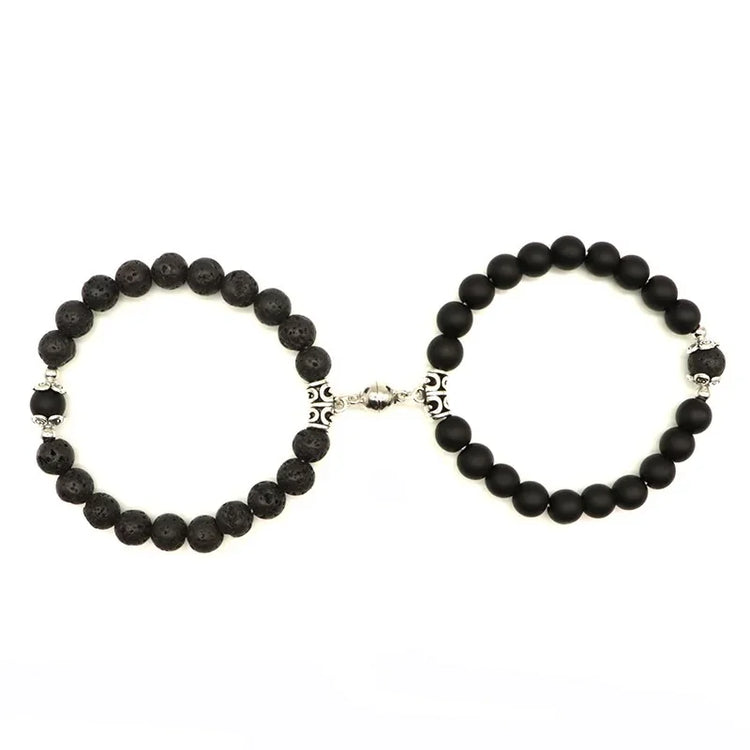 Unique black beaded bracelets with intricate silver accents, captivating modern jewelry design