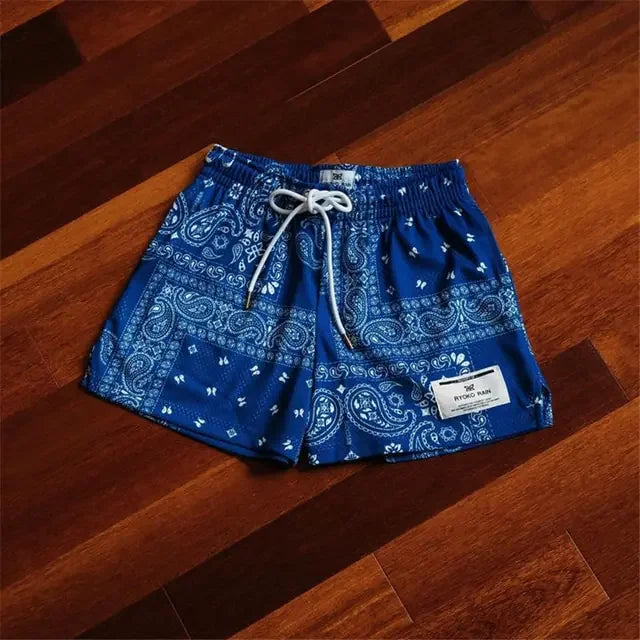 Eye-catching blue paisley shorts with drawstring and patch detail, bold style for unique wardrobes