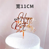 Shiny rose gold acrylic Happy Birthday cake topper with heart accents, adding unique flair