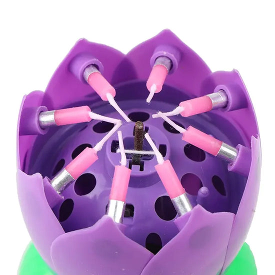 Purple lotus flower candle holder with pink candles, a unique decorative home accent.