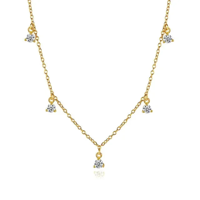 Elegant gold chain necklace with sparkling crystal charms, inviting unique style and curiosity.