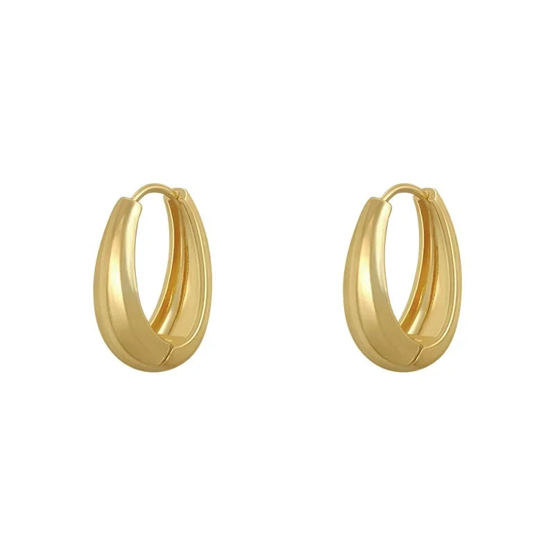 Elegant gold hoop earrings with a bold, modern design—discover your unique jewelry style.