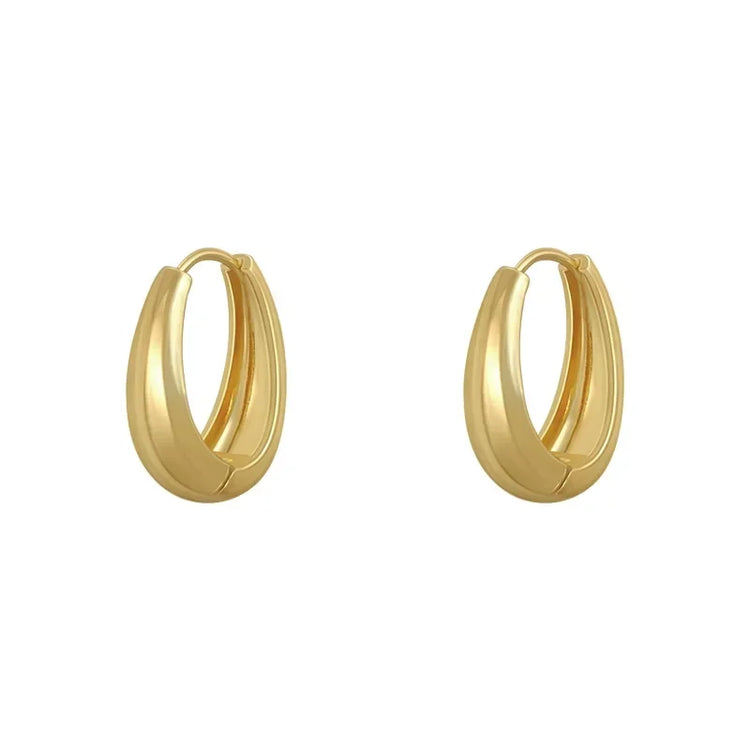 Elegant gold hoop earrings with a bold, modern design—discover your unique jewelry style.