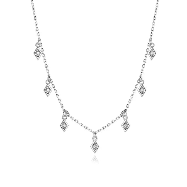 Elegant silver necklace with unique diamond-shaped pendants, perfect for standout style.