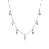 Elegant silver necklace with unique diamond-shaped pendants, perfect for standout style.