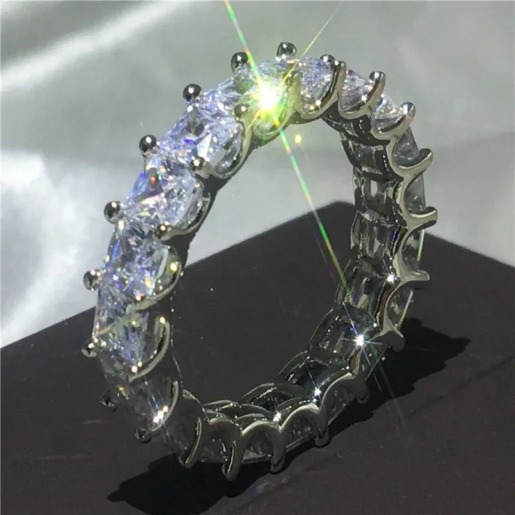 Dazzling eternity band ring with sparkling round gemstones, perfect for unique jewelry lovers.