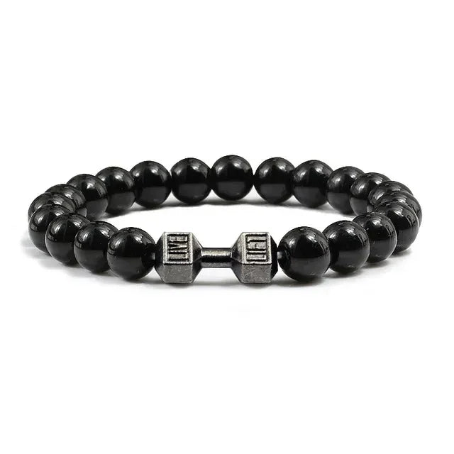 Bold black beaded bracelet with unique silver dumbbell charm, a standout accessory for fitness fans.