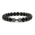 Bold black beaded bracelet with unique silver dumbbell charm, a standout accessory for fitness fans.
