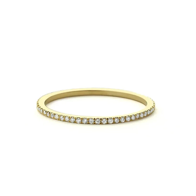 Elegant thin gold band with sparkling diamonds, perfect for adding a touch of unique style.
