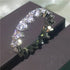 Sparkling silver eternity ring with round-cut stones and heart-shaped design, uniquely eye-catching