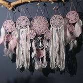 Enchanting pink dreamcatchers with intricate lace, feathers, and boho décor elegance