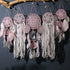 Enchanting pink dreamcatchers with intricate lace, feathers, and boho décor elegance