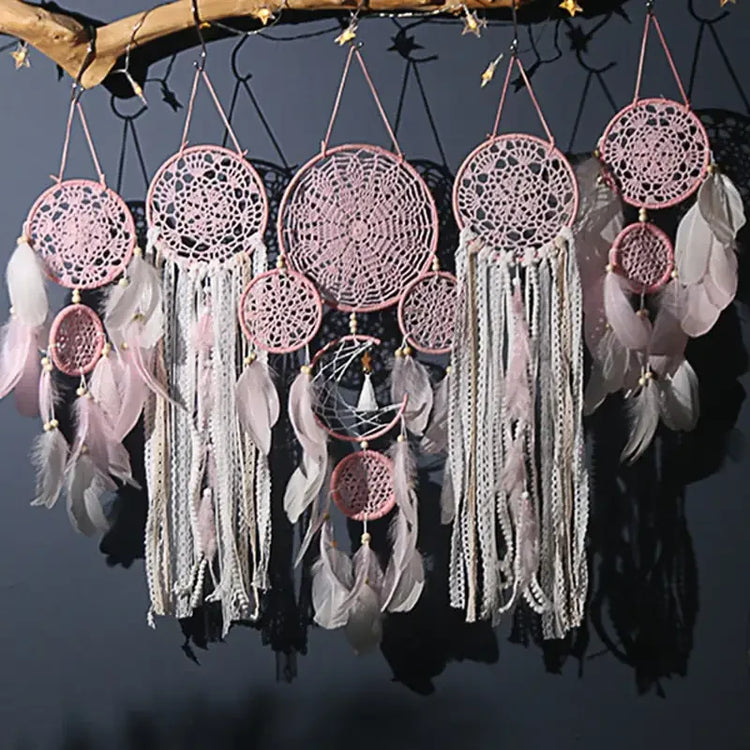 Enchanting pink dreamcatchers with intricate lace, feathers, and boho décor elegance