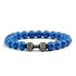 Vivid blue beaded bracelet with unique silver dumbbell charm, perfect for bold personal style.