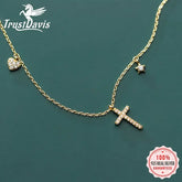 Sparkling gold chain necklace with crystal cross, heart, and star charms for a unique look