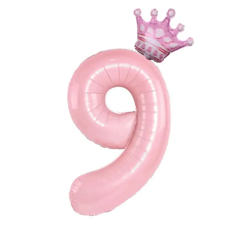 Playful pink number nine balloon with a whimsical pink crown, perfect for unique party decor.