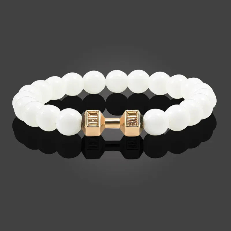 Intriguing white beaded bracelet with unique gold dumbbell charm, modern and stylish design