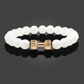 Intriguing white beaded bracelet with unique gold dumbbell charm, modern and stylish design
